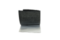 Self adhesive foam strip peeled away from lining paper.