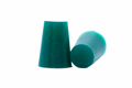 Two Tapered Silicone Plugs in Green. One standing up and the other on its side.
