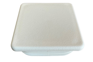 Angled view of a white plastic square tube insert.