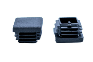 Two black plastic tube inserts. Both standing, one showing the top of the insert and one showing the bottom.