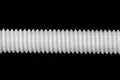 Close up of a threaded nylon rod.