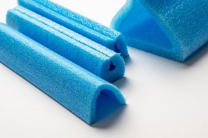 Expanded blue foam packaging in different shapes and sizes.