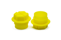 Two yellow plastic BSP Threaded plugs with a hex shaped head and recessed cross.