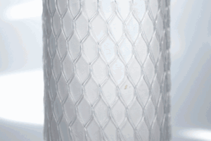 Clear plastic protective bottle netting, stretched over a tube.
