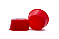 Two red plastic tapered plugs at different angles.