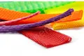 A selection of plastic protecting netting. In various sizes. Pink, Purple, Orange, Red, Yellow and Green.