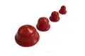 Four red vinyl plugs. In descending size left to right.