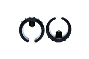 Front on image of two black plastic saddle feet with locating peg