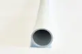 A close up view of a white plastic extruded round tube.