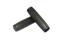 Angled top down view of two black, glossy ribbed plastic handle grip with a slightly tapered cylindrical shape and rounded ends.