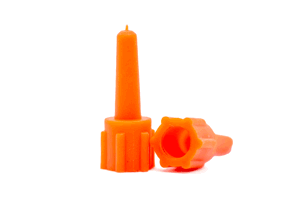 Two orange plastic collar plugs. One standing up, one on its side.