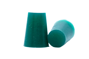 Two green Silicone Tapered plugs. One standing and one on its side.