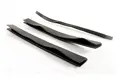 Cut pieces of flexible pvc edging strip laying on white background.