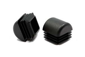 Two black plastic square tube inserts with domed tops. One standing up, the other on its side.