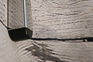 A black plastic square tube insert with a domed top. Fitted into a chrome square tube.