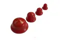Four red vinyl plugs. In descending size left to right.