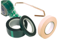 A selection of masking products, green polyester tapes, discs, metal hook and paper masking tape.