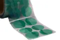 Green polyester masking discs on a clear liner. Arranged two wide on a roll.