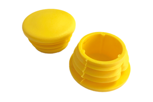 Pair of yellow plastic plugs showing the top and the bottom.