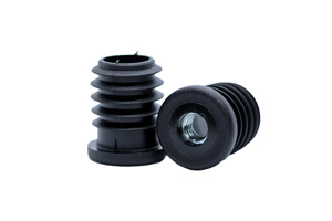 Two black plastic round tube inserts, with a metal threaded hole. One standing up and the other on its side showing the threaded hole.