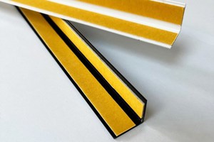 Two right angled plastic extrusions in white and black. With Self adhesive tape fitted to both internal faces.