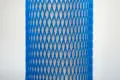 Blue plastic protective netting, stretched over a tube.