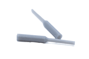 Two white silicone plugs. With a tapered step in the middle.