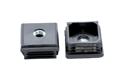 Two black plastic square tube inserts with metal threaded holes. Both standing up, showing opposite ends.