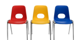 Primary school chairs in a line, red yellow and blue.