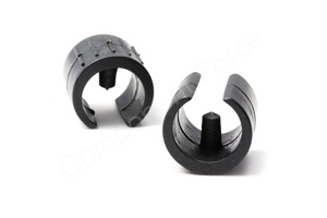 Angled view of two black plastic saddle feet with locating peg.