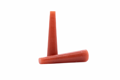 Two Tapered Silicone Plugs in Red. One standing up and the other on its side.