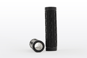 Side view of two black plastic patterned industrial grip handles that are open both ends. One is upright, the other on its side.