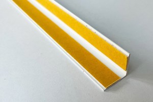A right angled plastic extrusion in white. With Self adhesive tape fitted to both internal faces.
