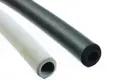 Diagonal view of two foam extrusion moulded sleeves. One is black and smooth, the other is grey and textured.