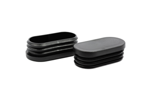 Two black plastic oval tube inserts. Both standing up, showing opposite ends.
