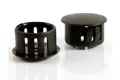 Two black plastic blanking plugs. Both standing up, showing opposite ends.